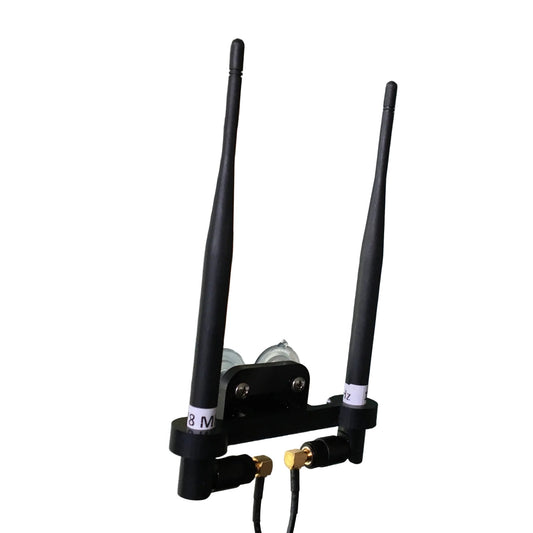 Two black whip antennas mounted inside an aircraft with a mounting bracket, alongside cables and suction cups.
